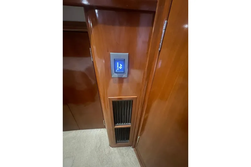 Slide: The Image of Luxurious cabin interior of 2004 Carver 570 Voyager Pilothouse with wood finish and bedding. - 29