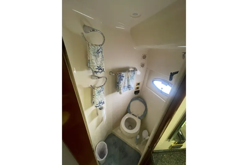 Slide: The Image of Luxurious bathroom in 2004 Carver 570 Voyager Pilothouse yacht with elegant wood cabinetry. - 36