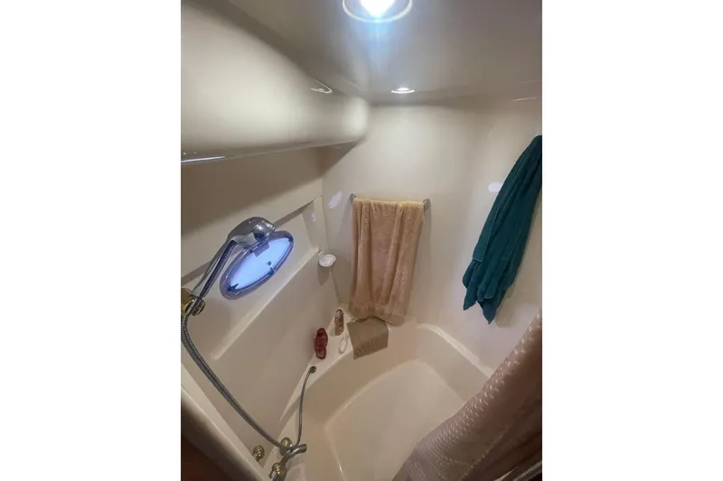 Slide: The Image of Bathroom interior of 2004 Carver 570 Voyager Pilothouse yacht with sink and shower. - 38