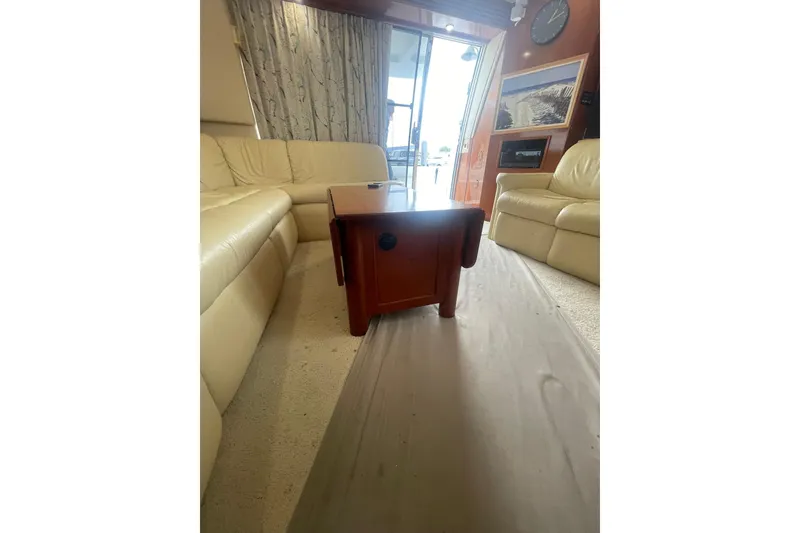 Slide: The Image of Luxurious interior of 2004 Carver 570 Voyager Pilothouse with leather seating and modern amenities. - 4