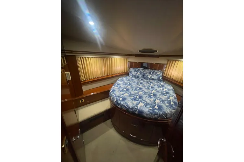 Slide: The Image of Luxurious bedroom interior of 2004 Carver 570 Voyager Pilothouse yacht with floral bedding. - 41