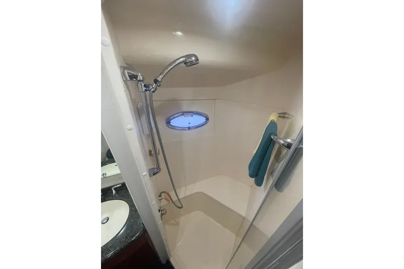 Slide: The Image of Luxurious bathroom in 2004 Carver 570 Voyager Pilothouse yacht with sink and shower. - 45