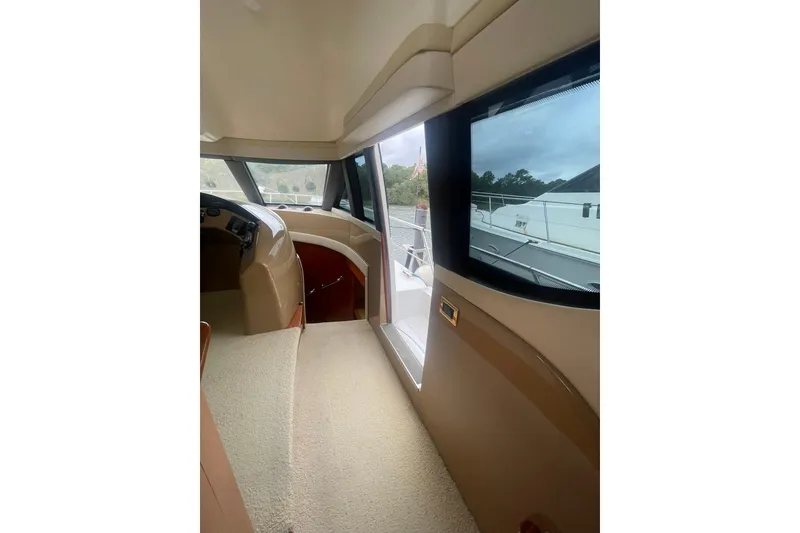 Slide: The Image of Bunk beds in 2004 Carver 570 Voyager Pilothouse cabin with window and curtains. - 48