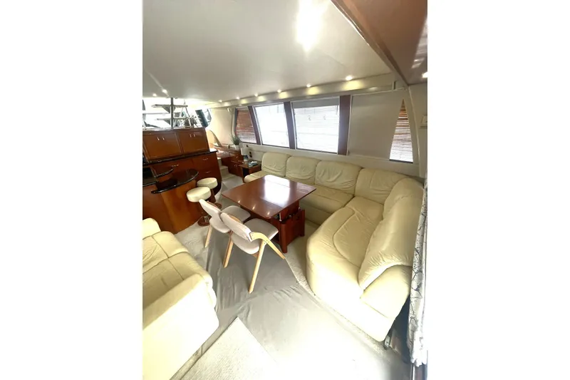 Slide: The Image of Luxurious interior of 2004 Carver 570 Voyager Pilothouse with leather seating and modern amenities. - 6