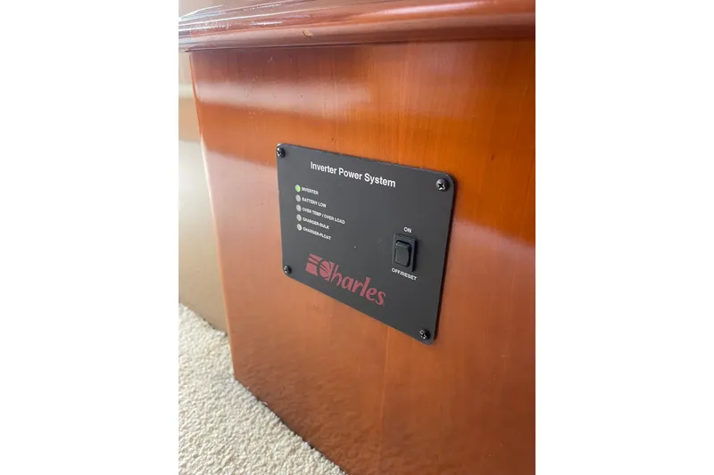 Slide: The Image of Electrical control panel inside 2004 Carver 570 Voyager Pilothouse yacht, with switches and gauges. - 61