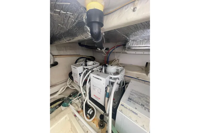 Slide: The Image of Engine room of 2004 Carver 570 Voyager Pilothouse yacht, showcasing machinery and components. - 64