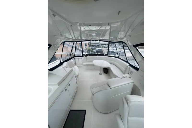 Slide: The Image of 2004 Carver 570 Voyager Pilothouse yacht docked on a cloudy day. - 69