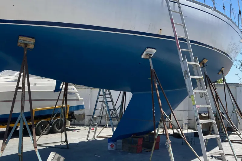 Slide: The Image of Close-up of a Nautor Swan 47 sailboat propeller, showcasing intricate gear details. - 11