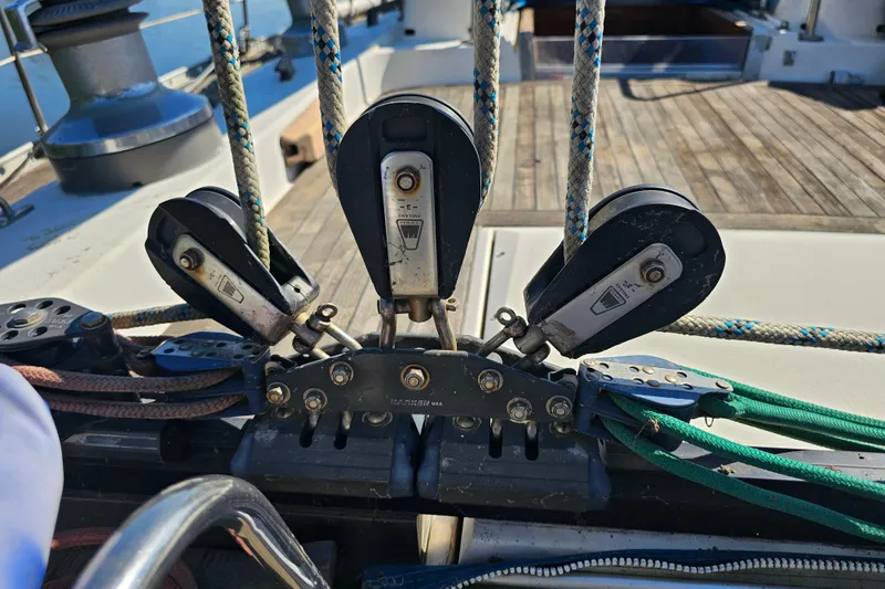 Slide: The Image of Bow of 1980 Nautor Swan 47 yacht with calm water reflection. - 17