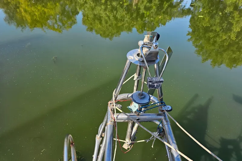 Slide: The Image of Interior of 1980 Nautor Swan 47 yacht with cushioned seating and backpack. - 19