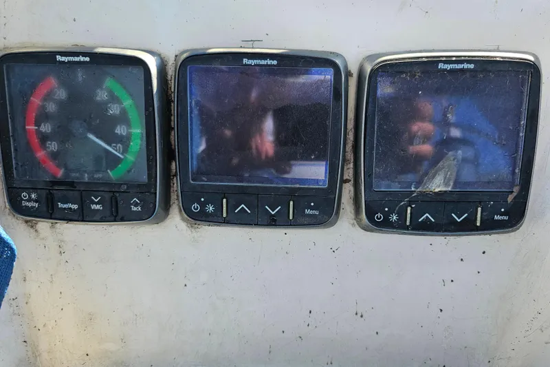 Slide: The Image of Cozy cabin interior of 1980 Nautor Swan 47 yacht with wooden shelves and bedding. - 20