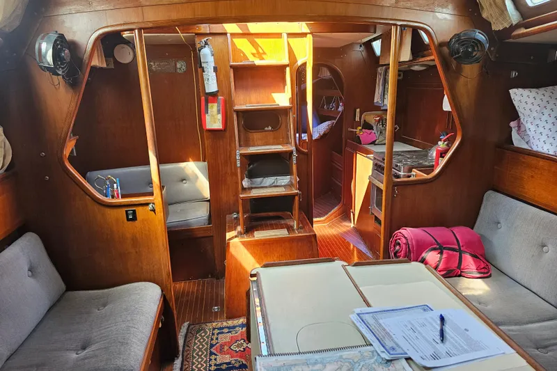 Slide: The Image of Interior of 1980 Nautor Swan 47 yacht with wooden desk and navigation equipment. - 23