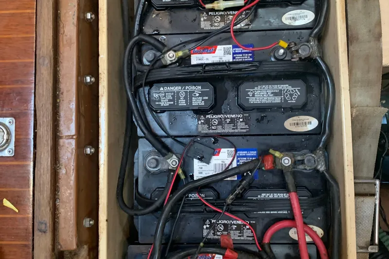 Slide: The Image of Interior of 1980 Nautor Swan 47 sailboat with wooden paneling and cushions. - 37