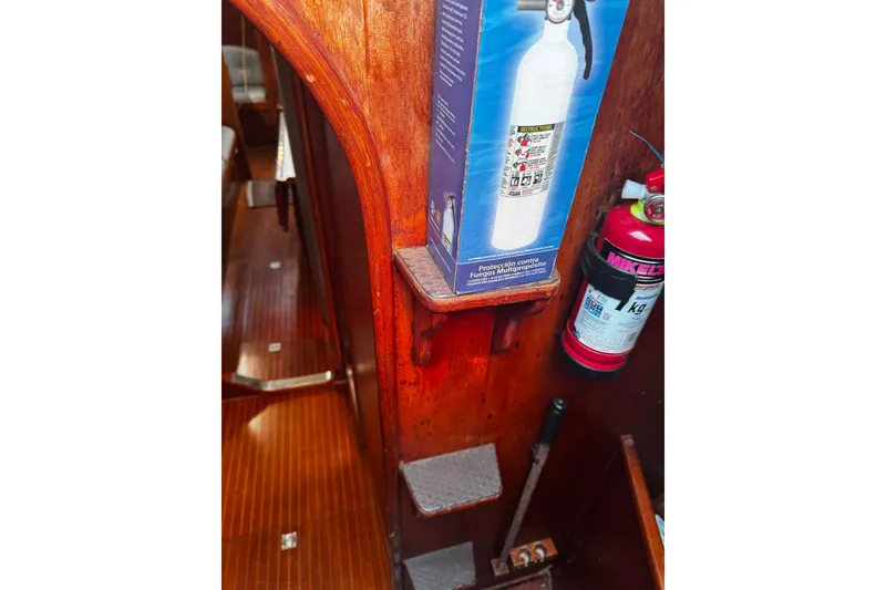 Slide: The Image of Interior of 1980 Nautor Swan 47 yacht with fire extinguishers and wooden steps. - 39