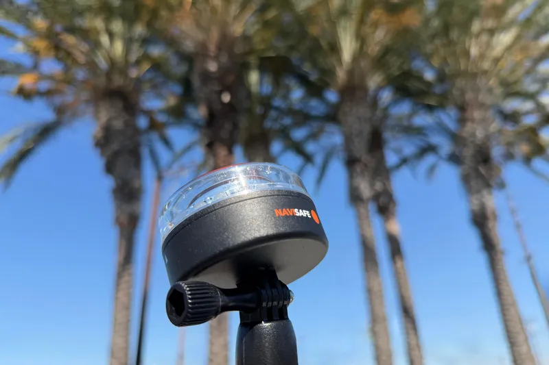 Slide: The Image of Navisafe light against palm trees and blue sky, Caribe MPV 10, 2025 model. - 25