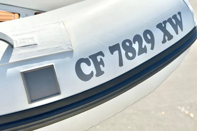 Slide: The Image of Close-up of a 2025 Caribe MPV 10 boat with registration number CF 7829 XW. - 35