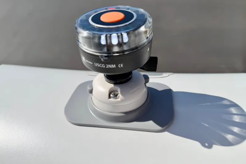 Slide: The Image of Navigation light on Caribe MPV 10, 2025 model, with USCG 2NM marking. - 38