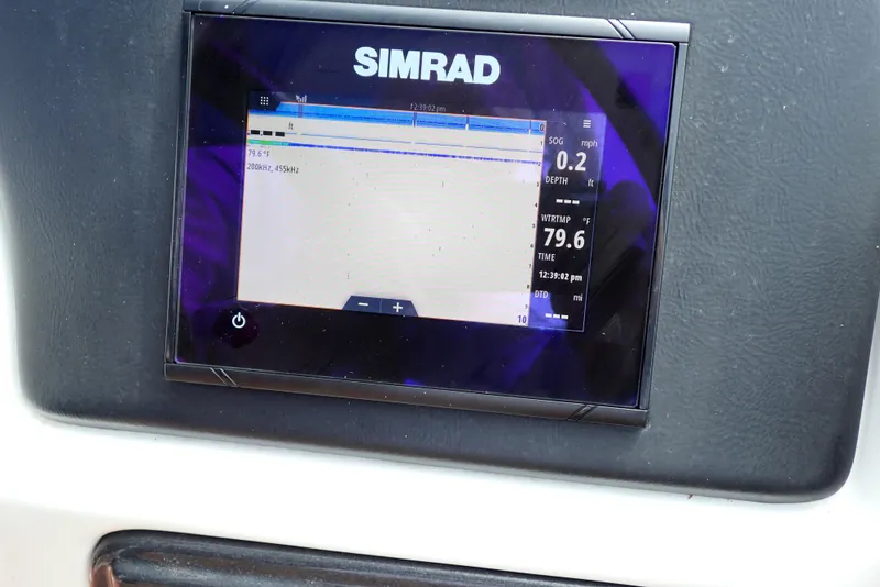 Slide: The Image of Simrad display on 2019 NauticStar 243DC Sport Deck boat dashboard. - 13