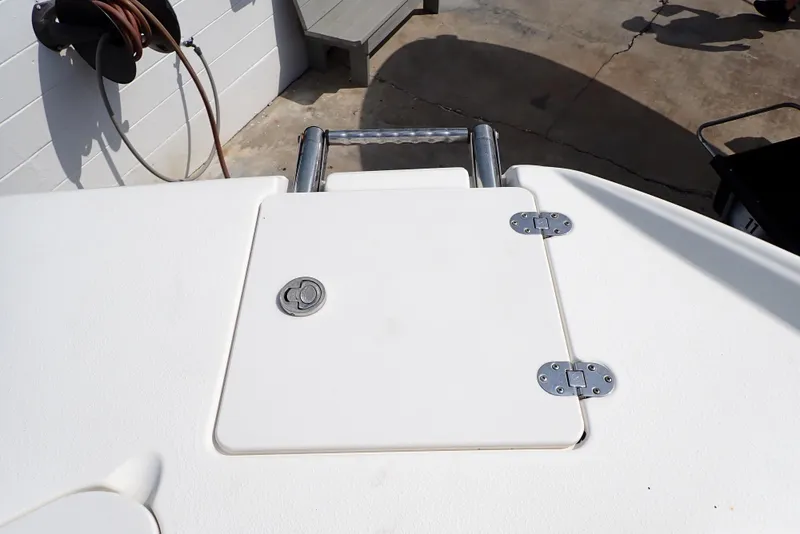Slide: The Image of 2019 NauticStar 243DC Sport Deck boat hatch with stainless steel ladder. - 26