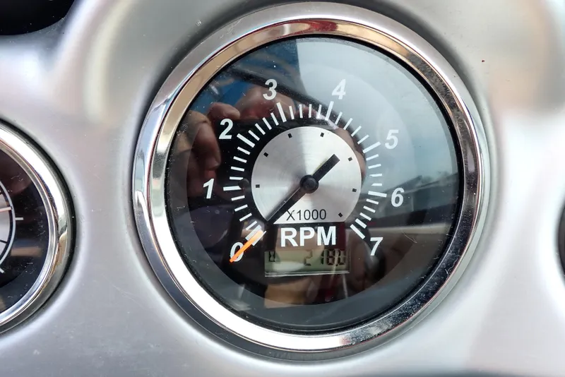 Slide: The Image of Tachometer of 2019 NauticStar 243DC Sport Deck showing RPM reading. - 3