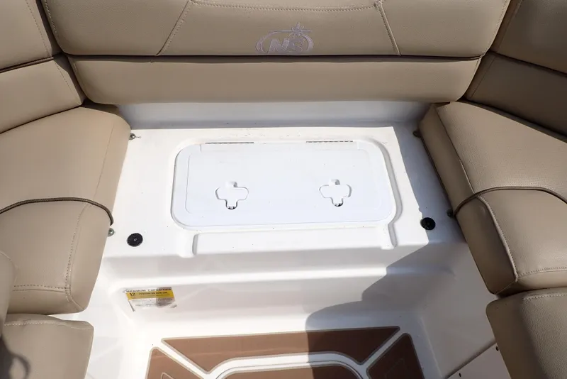 Slide: The Image of 2019 NauticStar 243DC Sport Deck boat seating with storage compartment. - 33