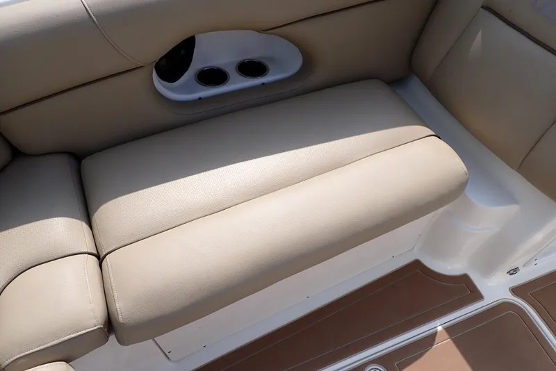 Slide: The Image of 2019 NauticStar 243DC Sport Deck boat interior seating with beige upholstery. - 35