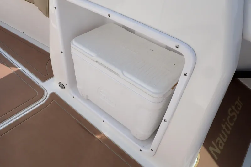 Slide: The Image of 2019 NauticStar 243DC Sport Deck with built-in cooler storage. - 39