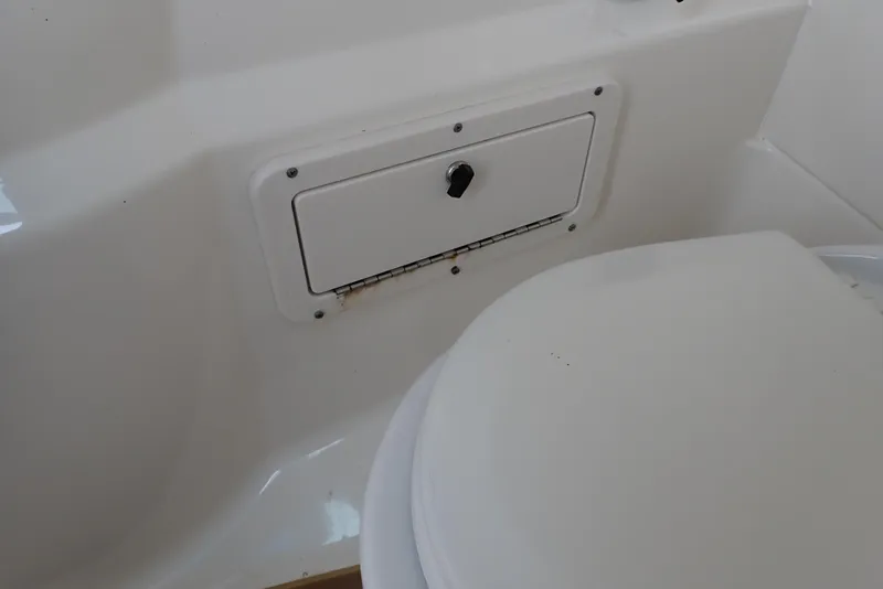 Slide: The Image of 2019 NauticStar 243DC Sport Deck interior storage compartment. - 47