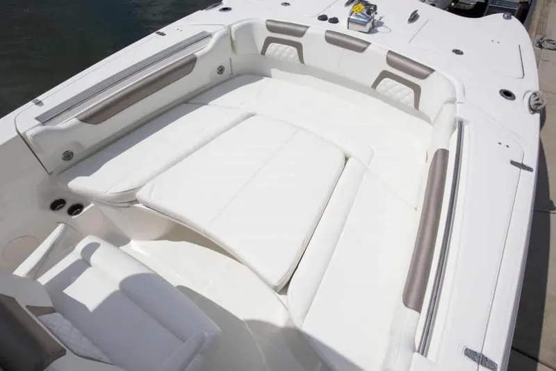 Slide: The Image of 2026 World Cat 295CC boat interior with spacious white seating area. - 16