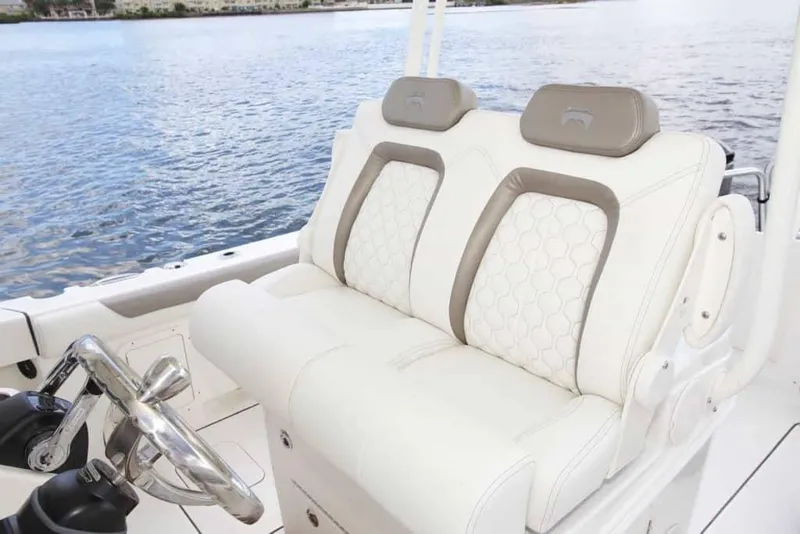 Slide: The Image of Luxury seating on 2026 World Cat 295CC boat with water view. - 19