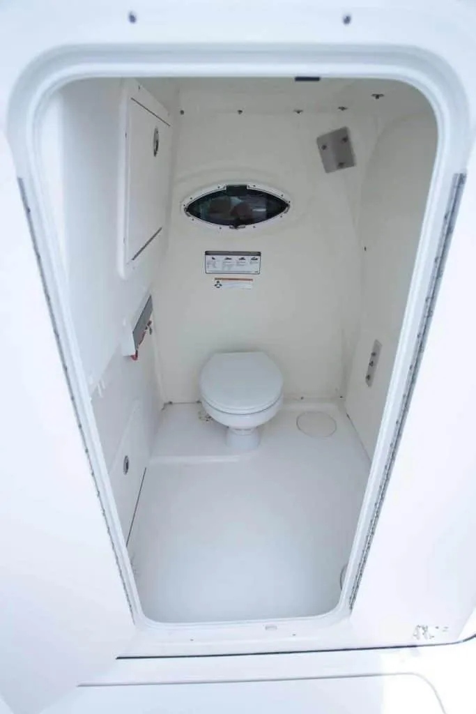 Slide: The Image of 2026 World Cat 295CC boat interior with compact marine toilet. - 28