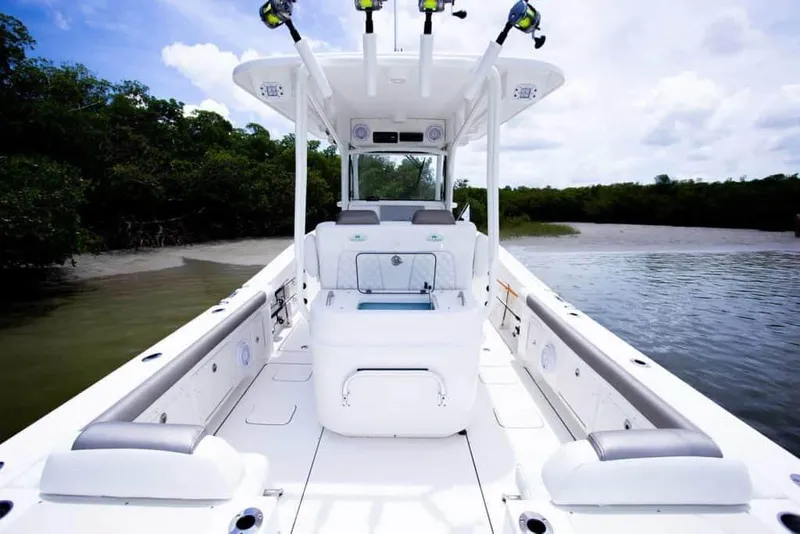 Slide: The Image of 2026 World Cat 295CC boat interior with seating and fishing rod holders. - 33