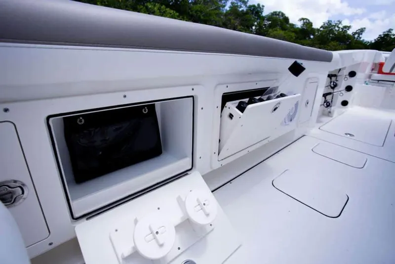 Slide: The Image of 2026 World Cat 295CC boat storage compartments and seating area. - 34