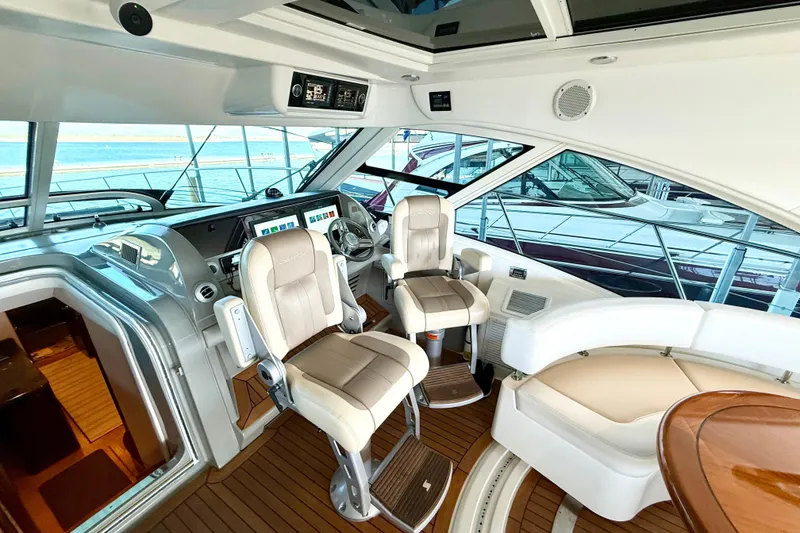 Slide: The Image of Luxurious interior of 2014 Sea Ray 580 Sundancer yacht with modern helm and seating. - 14