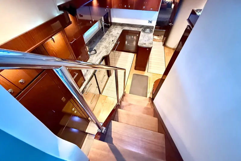 Slide: The Image of Luxurious interior of 2014 Sea Ray 580 Sundancer yacht with modern kitchen and wooden stairs. - 16