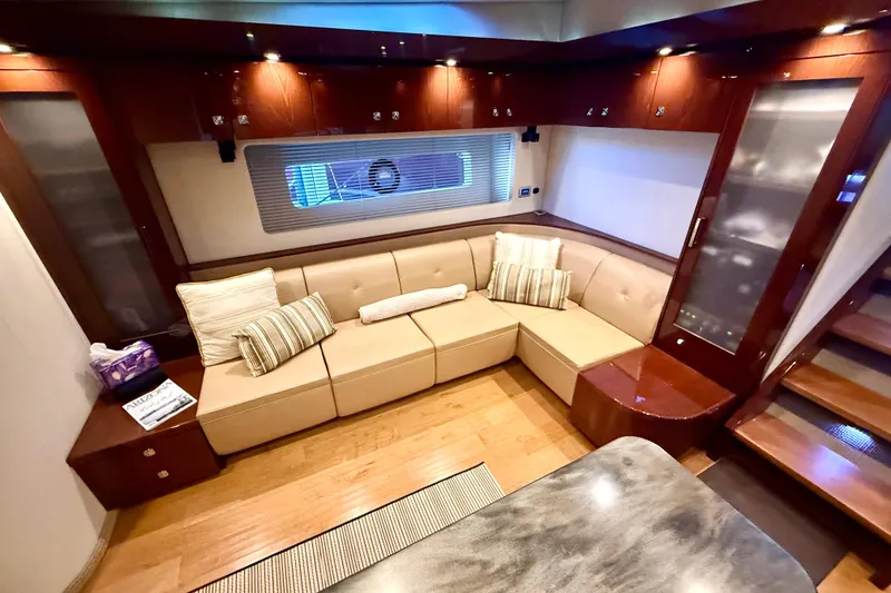 Slide: The Image of Luxurious interior of 2014 Sea Ray 580 Sundancer yacht with plush seating and elegant wood finishes. - 19