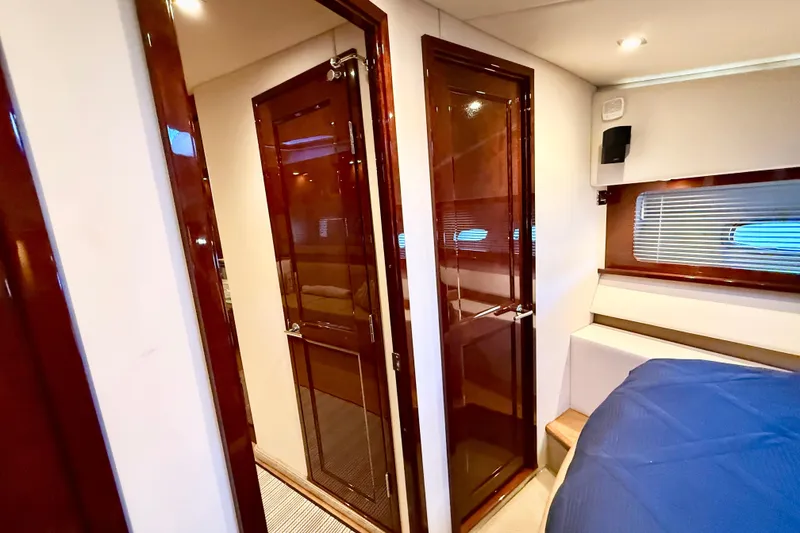 Slide: The Image of Luxurious interior of 2014 Sea Ray 580 Sundancer yacht with polished wood finishes. - 24