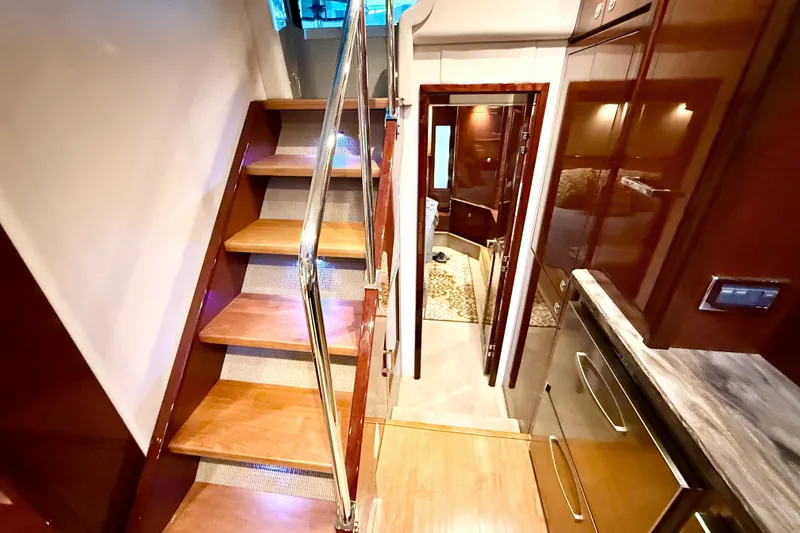 Slide: The Image of Interior of 2014 Sea Ray 580 Sundancer yacht with wooden stairs and modern design. - 27