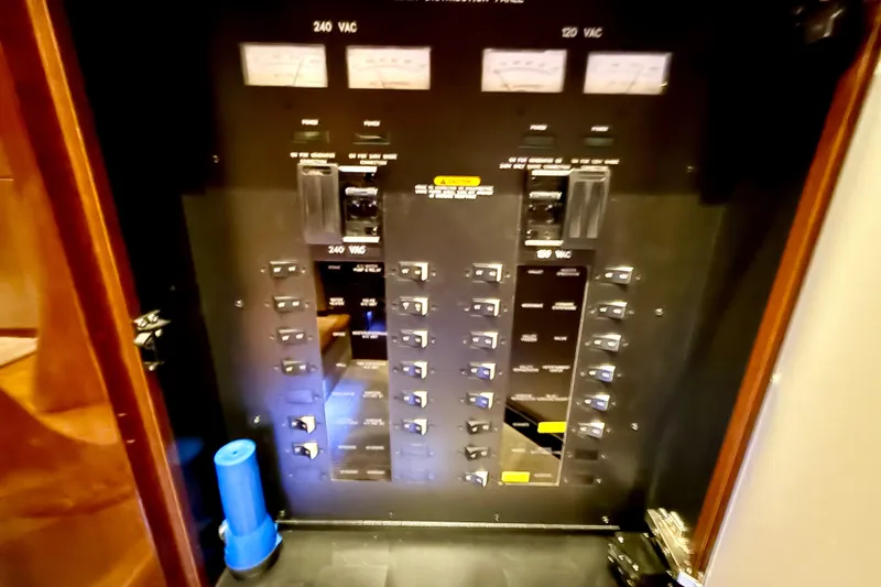 Slide: The Image of Electrical panel on 2014 Sea Ray 580 Sundancer yacht, featuring 240 VAC and 120 VAC controls. - 36
