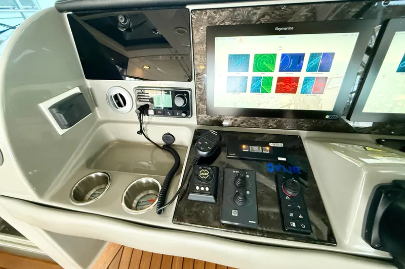 Slide: The Image of Control panel of 2014 Sea Ray 580 Sundancer with navigation screens and controls. - 39