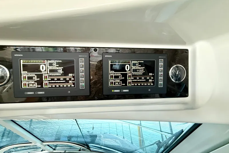 Slide: The Image of Control panel of a 2014 Sea Ray 580 Sundancer yacht, displaying engine metrics. - 46