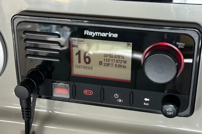 Slide: The Image of Raymarine marine radio on 2014 Sea Ray 580 Sundancer displaying distress signal coordinates. - 48