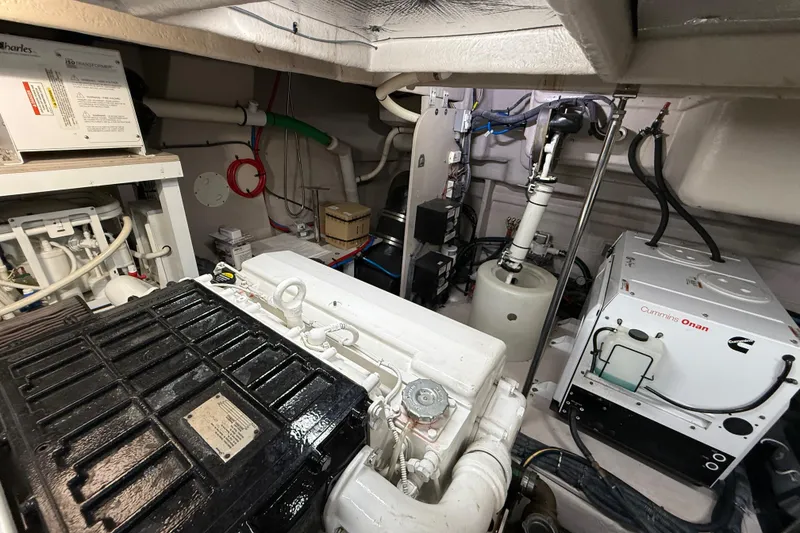 Slide: The Image of Engine room of 2014 Sea Ray 580 Sundancer with Cummins Onan generator and equipment. - 53