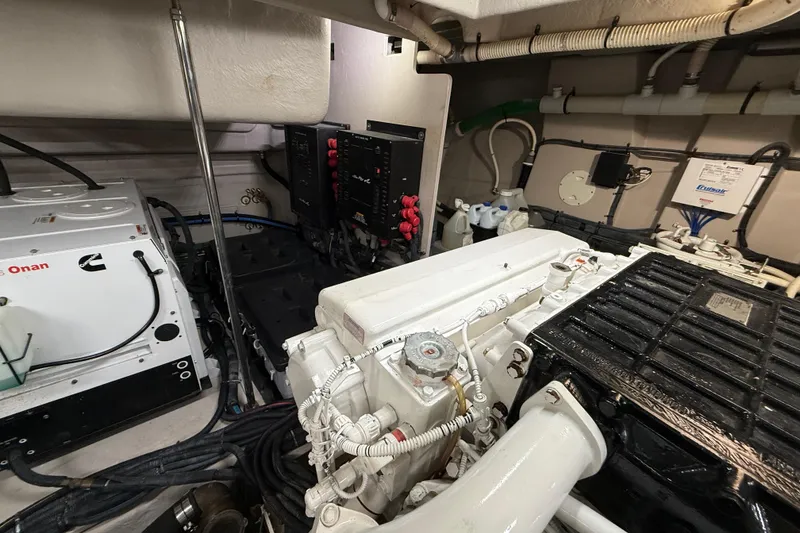 Slide: The Image of Engine room of 2014 Sea Ray 580 Sundancer with Cummins Onan generator and wiring. - 54