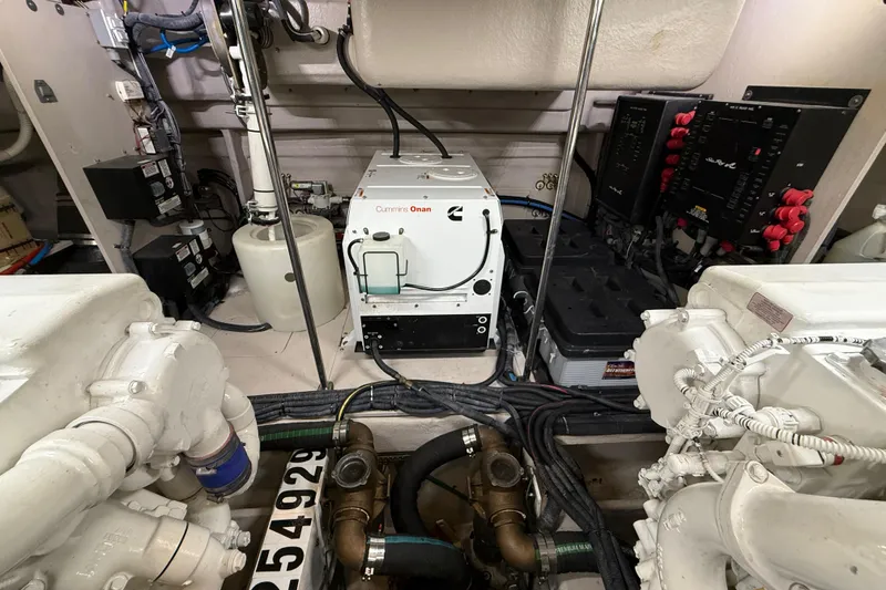 Slide: The Image of Engine room of 2014 Sea Ray 580 Sundancer with Cummins Onan generator and electrical systems. - 55