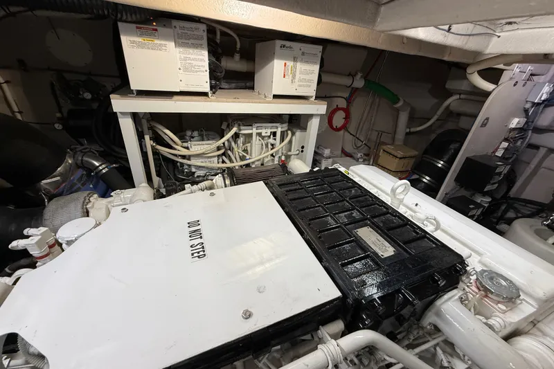 Slide: The Image of Engine room of 2014 Sea Ray 580 Sundancer with visible machinery and equipment. - 56