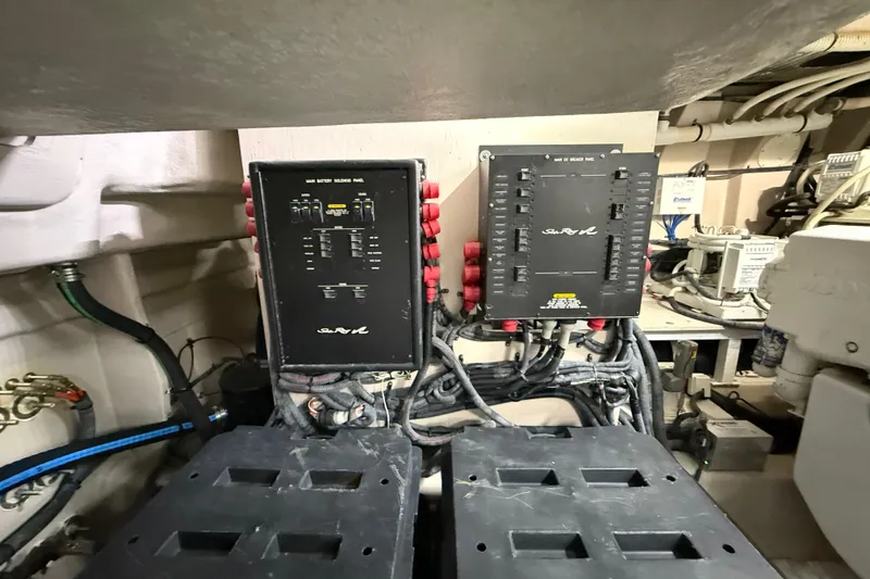 Slide: The Image of Engine room of 2014 Sea Ray 580 Sundancer with electrical panels and wiring. - 62
