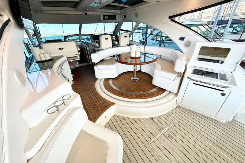 Slide: The Image of Luxurious interior of 2014 Sea Ray 580 Sundancer yacht with elegant seating and wood flooring. - 7