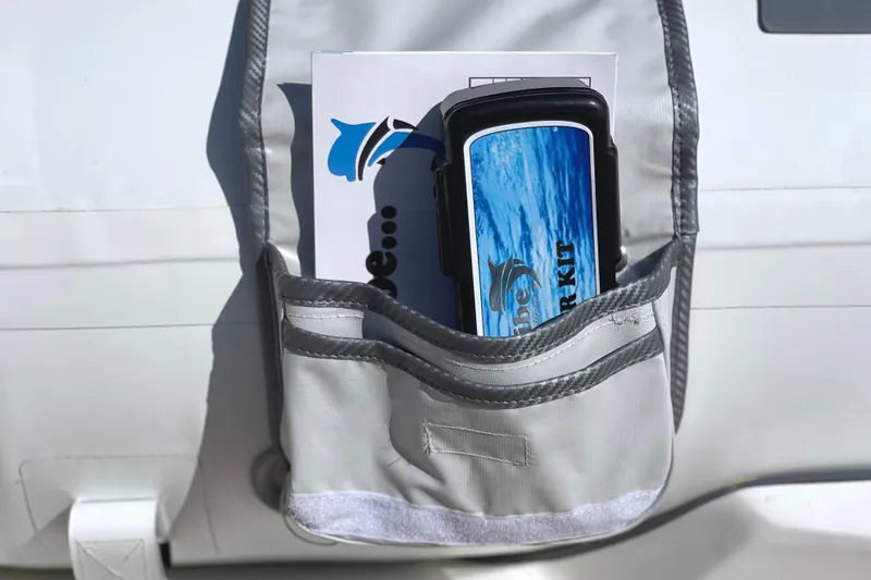 Slide: The Image of Gray pocket holding a Caribe L8 owner's manual and toolkit, 2025 model. - 29