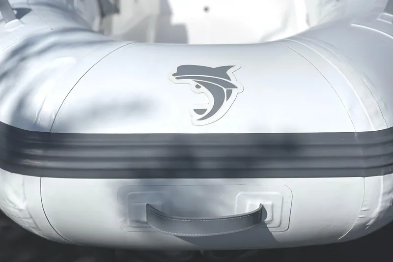 Slide: The Image of Inflatable boat with shark logo, Caribe L8 model, 2025 design. - 5